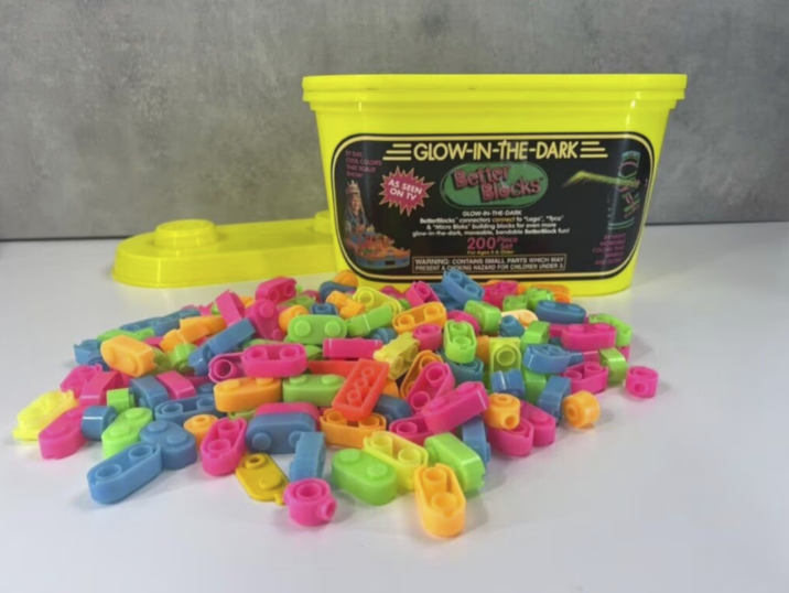 BY DAY COOL COLORS THAT REALLY SHOW GLOW-IN-THE-DARK= SAS SEEN ON TV Better Blocks GLOW-IN-THE-DARK Betterblocks connectors connect to "Lego", "Tyco "Micro Bloks building blocks for even more ow-in-the-dark, moveable, bendable Betterlock fun! 200 For Ages & Onder WARNING: CONTAINS SMALL PARTS WHICH MAY PRESENT A CHOKING HAZARD FOR CHILDREN UNDER S