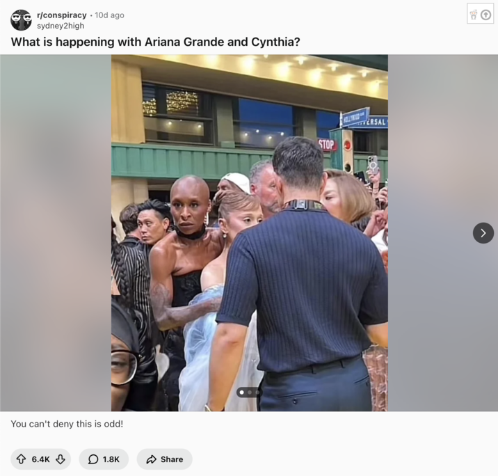 Redditor /u/sydney2high posted an image of Cynthia Erivo protecting Ariana Grande to the subreddit /r/conspiracy, gathering over 6,000 upvotes in ten days.