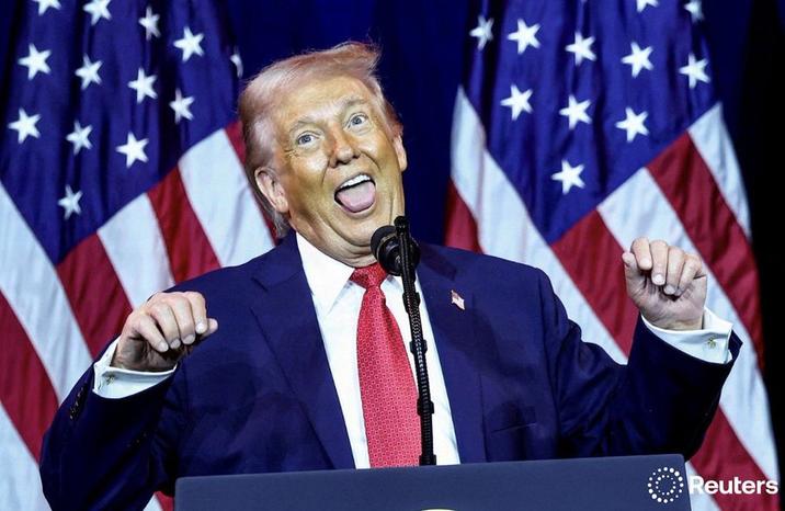 A Reuters screenshot. The image shows Trump doing an ahegao face.