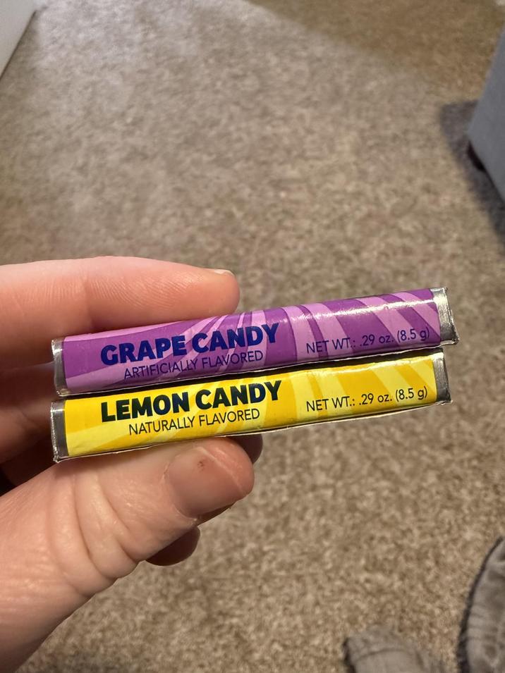 GRAPE CANDY ARTIFICIALLY FLAVORED LEMON CANDY NATURALLY FLAVORED NET WT: .29 oz. (8.5 g) NET WT: .29 oz. (8.5 g)