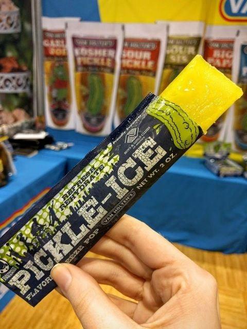GAZL BOOSHER SOUR PICKLE OUR 975 BIG CAP CKLE REHYDRATE REFRESH Proudly Sups GIRL S CLUBS PICKLE-ICE FLAVOR EEZE POP VAN HOLTEN'S NET WT. 2 OZ.