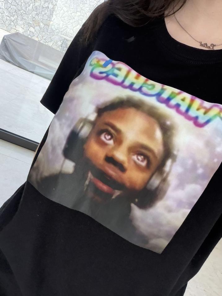 A woman wearing a Speed Watches shirt.