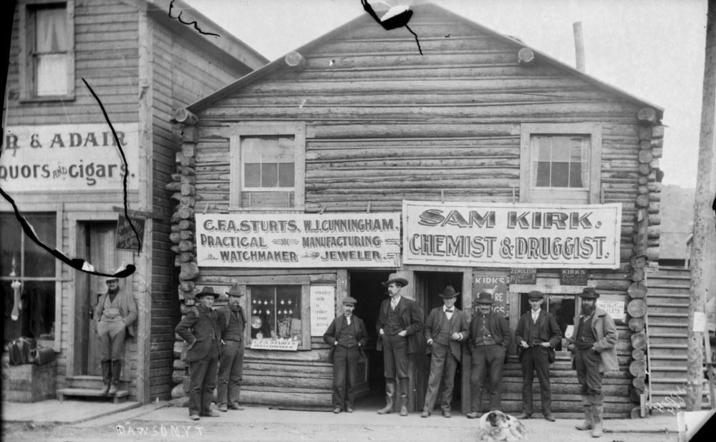 R & ADAIR Quors cigars. BAWSUMYT C.F.A.STURTS. WJ.CUNNINGHAM PRACTICAL MANUFACTURING WATCHMAKER JEWELER. SAM KIRK. CHEMIST&DRUGGIST. KIRKS RE ZENOLET KIRKS