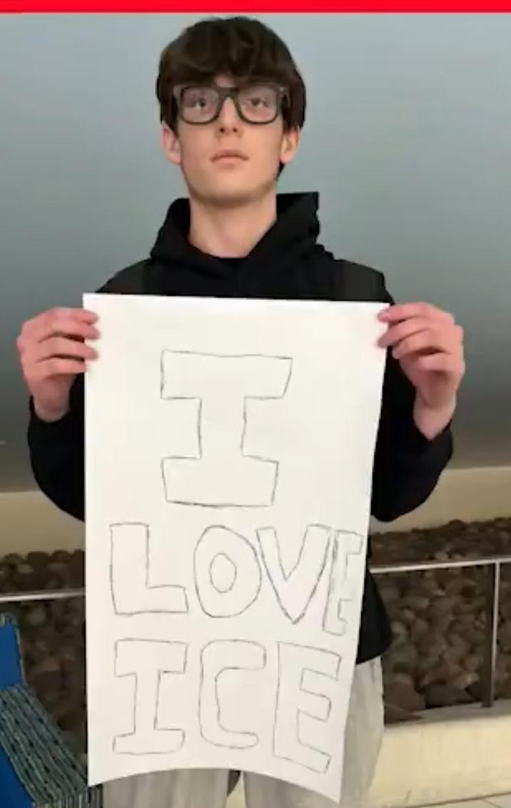 An image of Danny Spud holding a sign that reads "I love ICE." He was punched shortly after this.