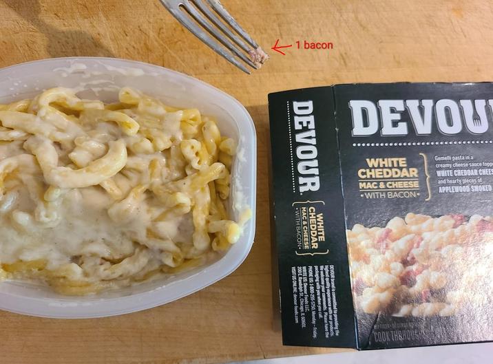 1 bacon DEVOU WHITE CHEDDAR MAC & CHEESE WITH BACON Gemelli pasta in a creamy cheese sauce topp WHITE CHEDDAR CHEES and hearty pieces of APPLEWOOD SMOKED DEVOUR WHITE CHEDDA EDDAR MAC & CHEESE CHEESE WITH BACON DEVOUR brand is conca with our products. me your comments. Please have the kaging with you when you day-Friday. PHONE US: 1-800-255-5750, M 200 F Randolph St., Chicago, IL 60601. VISIT US ONLINE: devour-foods.com COOK THEROUSH
