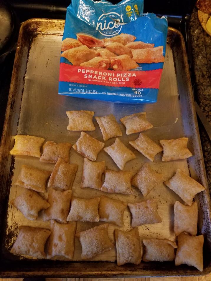 ISFACTION SIMPLE HONEST nice ORLICIONS PROTEIN CA PEPPERONI PIZZA SNACK ROLLS ENLARGED TO SHOW DETAIL PEPPERONI PIZZA IN A GOLDEN CRUST STAVING NET WT 20 02 (1 LB 4.07) 587- APPROX 40 COOK THOROUGHLY KEEP FROZEN COUNT