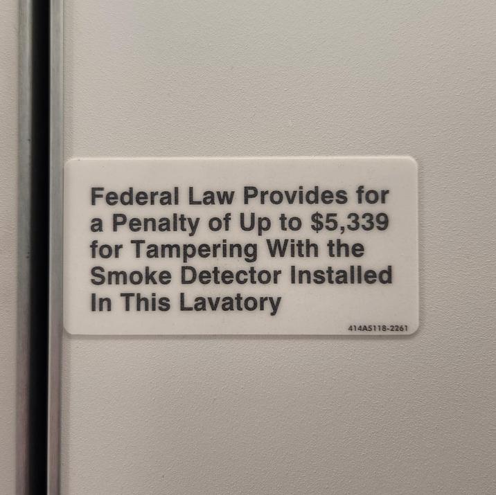 Federal Law Provides for a Penalty of Up to $5,339 for Tampering With the Smoke Detector Installed In This Lavatory 414A5118-2261