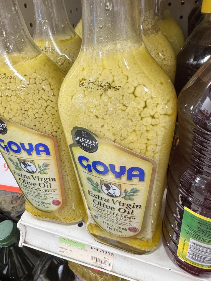 225 /2027 202 4513-01725 BB.01/17/2027 EST RD LENCE GOYA Extra Virgin Olive Oil FIRST OLD PRESS UM ACIDITY 0.4% ANDALIDUCT O MEN ESPAR ASPAANA SAU 17 fl.oz. (500 ml) 1pt 1fl.oz. CHEFSBEST AWARD CELLENCE GOYA Extra Virgin Olive Oil FIRST COLD PRESS MAXIMUM ACIDITY 0.4% AND COVA EN ESPANN 17 fl.oz. (500 ml) 1 pt. 1 fl.oz. MUST BY SEE BOTTLE Aceite V con Ad Vegetab with Au Before: Ver e No refrigerar / Do not 7 86 1048 690911 PER OLSCE RIYA EXTRA VIRGIN OIL 04133101107 08/25 14.99 17 oz. 04133101107 pr/Distributed by Family Fa