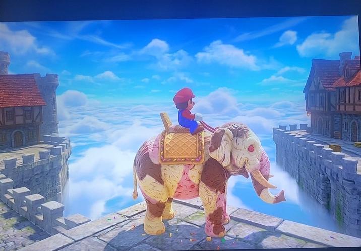 An alleged screenshot from Super Mario Titans, which may not even exist. It shows Mario riding an ice cream elephant.