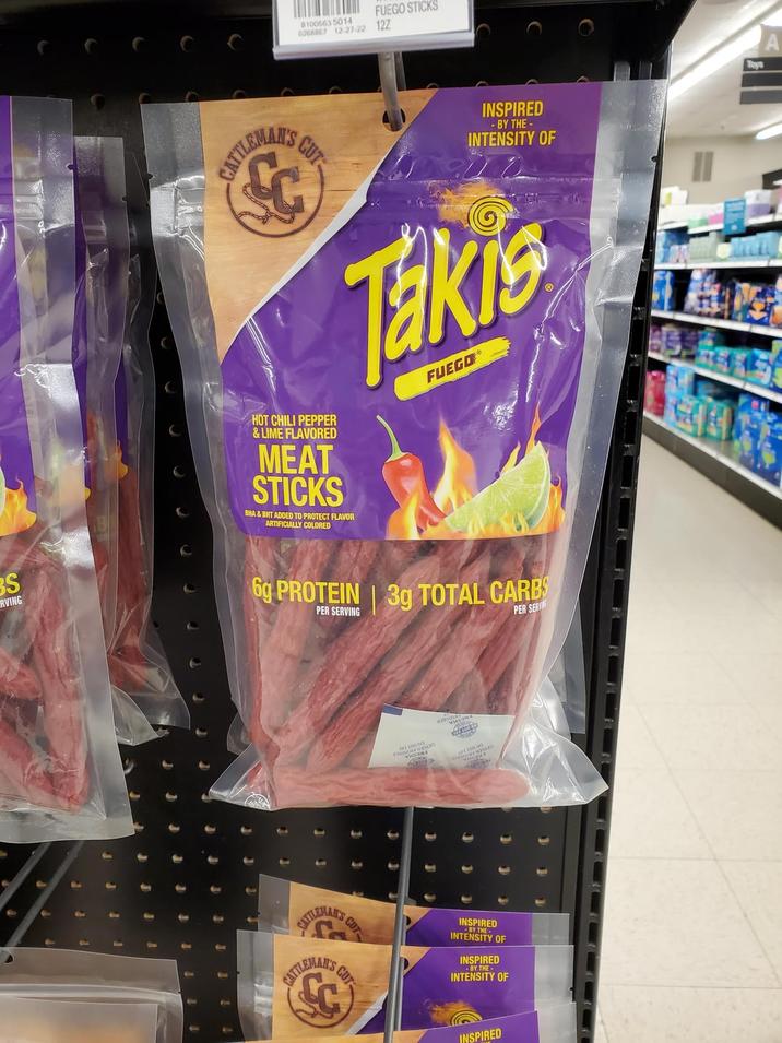8100563 5014 FUEGO STICKS 0268867 12-27-22 12Z CATTLEMAN'S CUT INSPIRED - BY THE- INTENSITY OF HOT CHILI PEPPER &LIME FLAVORED MEAT STICKS BHA&BHT ADDED TO PROTECT FLAVOR ARTIFICIALLY COLORED Takis FUEGO® BS RVING 6g PROTEIN 3g TOTAL CARBS PER SERVING PER SERIE CUT CATTLEMAN'S CATTLEMAN'S CUT O INSPIRED INTENSITY OF -BY THE- INSPIRED BY THE- INTENSITY OF INSPIRED Rays