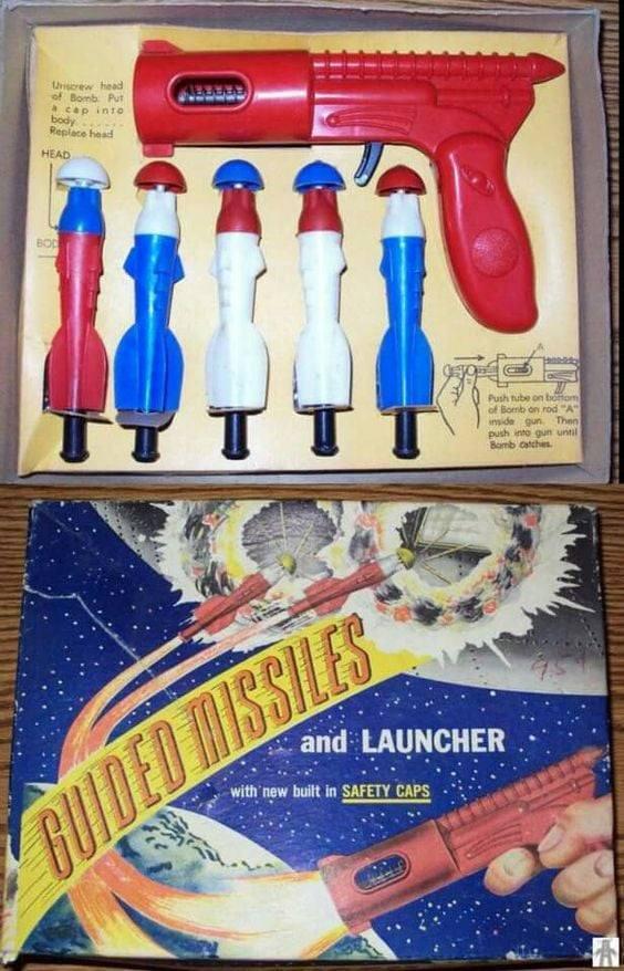 Unscrew head of Bomb Put a cap into body Replace head HEAD BOD TTT Push tube on bottom of Bomb on rod "A" inside gun. Then push into gun until Bomb catches GUIDED MISSILES and LAUNCHER with new built in SAFETY CAPS