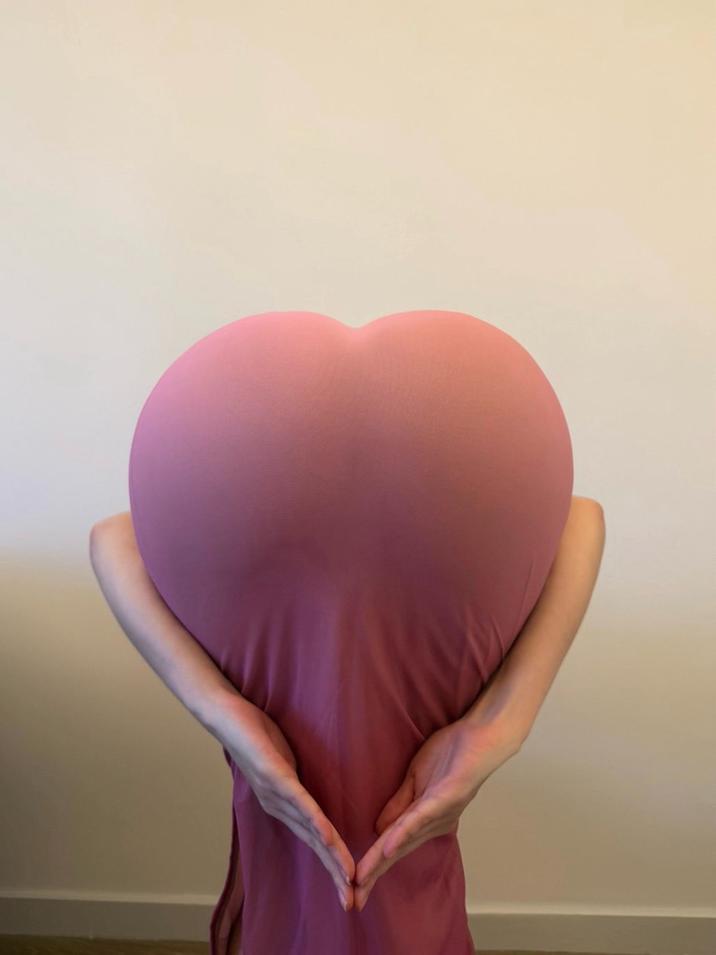 A photo of kykyky618 doing the heart butt challenge. This is her second photo doing the trend, which she started.