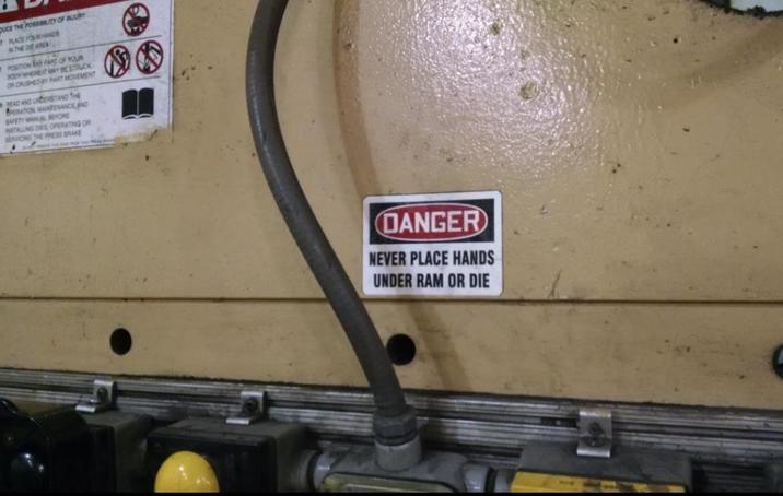 PUCE THE POSSIBILITY OF INJURY TPLACE YOUR HANDE IN THE DIE AREA POSITION ANY PART OF YOUR BODY WHEREIT MAY BE STRUCK OR CRUSHED BY PART MOVEMENT BEAD AND UNDERSTAND THE PERATION MAINTENANCE AND SAFETY MANUAL BEFORE INSTALLING DES OPERATING OR SERVICING THE PRESS BRAKE 08 DANGER NEVER PLACE HANDS UNDER RAM OR DIE