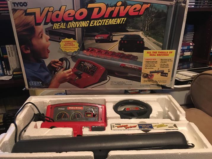 TYCO Video Driver REAL DRIVING EXCITEMENT! B-17 BOMBER SOLAR SAILER SEGA 2 COMPLETE GAMES INCLUDED California Chase Road Race TYCO Video Driver 100 Video Driver ALL THE THRILLS OF REAL DRIVING! COMPLETE WITH Deboard camole with working steering w Counter kg tra of how we d Matar dive or the VHS Video Cl Cute Player 13 20 N for Age And TYCO Video Driver CALIFORNIA CHASE NOAD RACE Nekonerie SERA