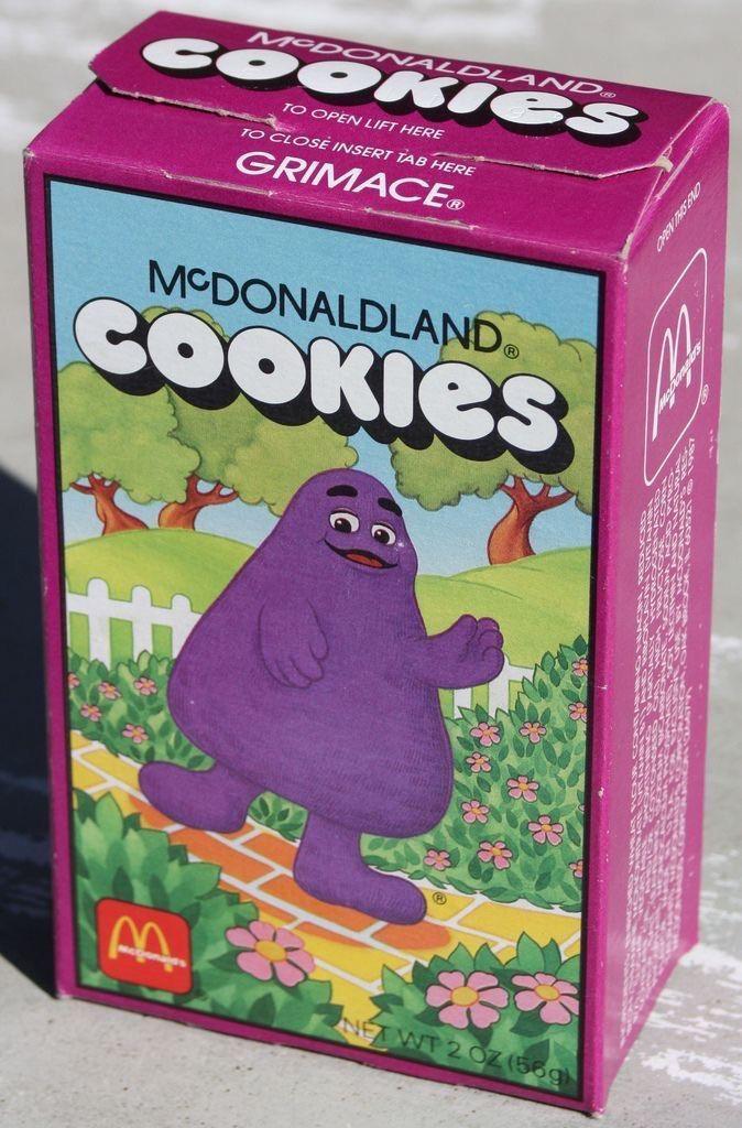 MCDONALDLAND COOKIES TO OPEN LIFT HERE TO CLOSE INSERT TAB HERE GRIMACE® ONG SHENGHO MCDONALDLAND COOKIES NET WT 2 OZ (56g)