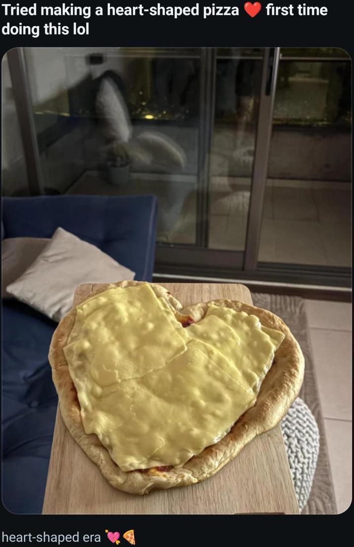 Tried making a heart-shaped pizza first time doing this lol heart-shaped era