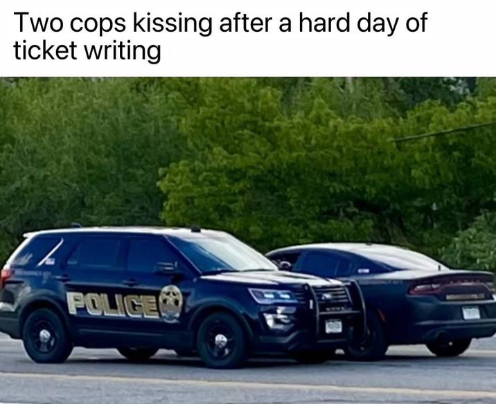 Two cops kissing after a hard day of ticket writing POLICE