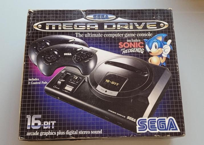 SEGA MEGA DRIVED SEEA The ultimate computer game console includes SONIC HEDGEHOG includes 2 Control Pads VOLUME -RESET TRIGGER 16-BIT POWER ON 16-BIT arcade graphics plus digital stereo sound MEGA DRIVE SEGA SEGA
