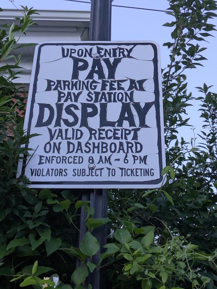 UPON ENTRY PAY PARKING FEE AT PAY STATION DISPLAY VALID RECEIPT ON DASHBOARD ENFORCED & AM-6PM VIOLATORS SUBJECT TO TICKETING