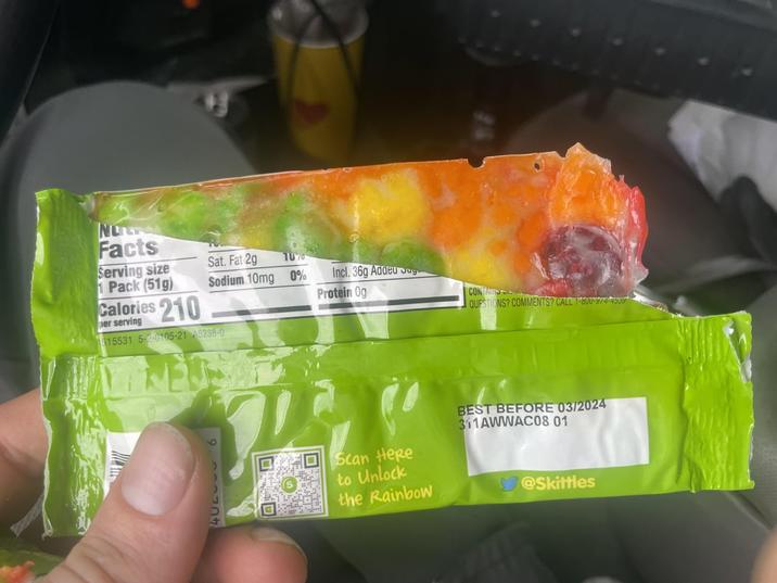 NO Facts Serving size 1 Pack (51g) Calories 210 per serving 515531 5-2-0105-21 A5238-0 NE 40206 6 Sat. Fat 2g 1070 Sodium 10mg 0% Incl. 36g Addeu g Protein Og CONTAINS QUESTIONS? COMMENTS? CALL 1-800-974-4539 Scan Here to Unlock the Rainbow BEST BEFORE 03/2024 311AWWAC08 01 @Skittles