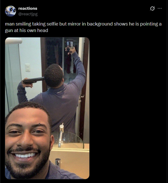reactions @reactjpg man smiling taking selfie but mirror in background shows he is pointing a gun at his own head