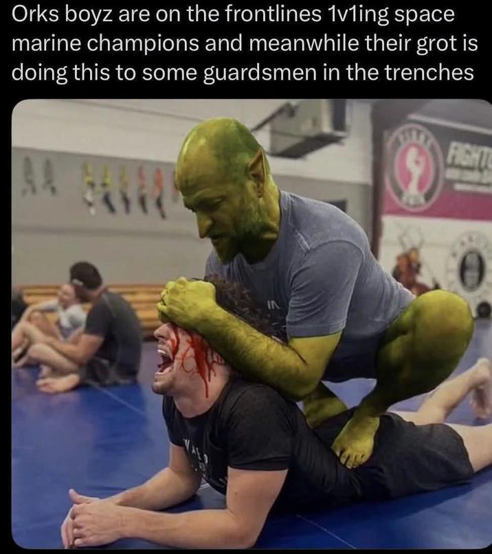 Orks boyz are on the frontlines 1vling space marine champions and meanwhile their grot is doing this to some guardsmen in the trenches FIGHT