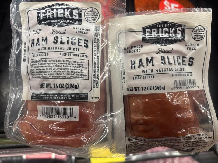 USE/FRZ BY DATE ON PKG FRICKS GLUTEN FREE QUALITY MEATS Biscuit U.S. INSPECTED AND PASSED BY DEPARTMENT OF AGRICULTURE EST. 2949 HARDWOOD SMOKED HAM SLICES WITH NATURAL JUICES FULLY COOKED KEEP REFRIGERATED Nutrition Facts Serving Size: 2 oz.(56g), Servings Per Container 7, Amount Per Serving: Calories 45, Total Fat 0g (0% DV), Cholesterol 35mg (12% DV), Sodium 590mg (25% DV), Total Carbohydrate Og (0% DV), Protein 10g, Iron (4% DV). Not a significant source of calories from fat, saturated fat, trans fal, dietary fiber, sugars, vitamin A, vitamin C and calcium. Percent Daily Values (DV) are based on a 2,000 calorie diet. NET WT. 14 OZ (396g) FRICK'S QUALITY MEATS, INC. WASHINGTON MO. 63090 www.FRICKMEATS.COM INGREDIENTS: PORK, WATER, CONTAINS LESS THAN 2% OF SALT, SODIUM CITRATE, SODIUM PHOSPHATE, BROWN SUGAR, SODIUM DIACETATE, SODIUM ERYTHORBATE, SODIUM HITRITE IS17045 USE/FRZ BY DAIL HARDWOOD SMOKED ESTO 1896 FRICKS QUALITY MEATS Biscuit U.S. INSPECTED AND PASSED BY DEPARTMENT OF AGRICULTURE EST. 2949 GLUTEN FREE HAM SLICES WITH NATURAL JUICES FULLY COOKED NET WT. 12 OZ (340g) KEEP REFRIGERATED 049521 166130 0 49521 16318 4 Nutrition Facts Saving Size: 2 oz (550), Servings Container Amount Per Serving Per (0% rol 35mg (12% DV), Sodium 590mg (20% DV To sydrate g (0% avs (4% DV ted fat GREDIENTS: PORK WATER FLESS THAN 2% OF SALT MIROWN SUGAR SODIUM CITRIDIUM PHO DIACETATE SE NORBATE, SODIUM