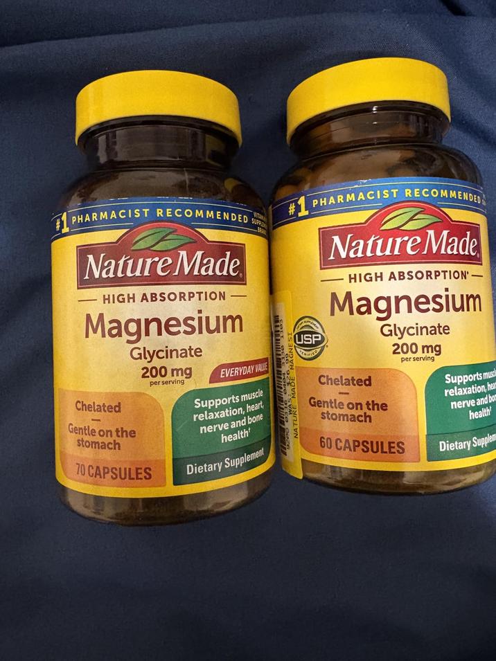 PHARMACIST RECOMMENDED S Nature Made HIGH ABSORPTION - Magnesium Chelated Gentle on the stomach Glycinate 200 mg 70 CAPSULES per serving VITAN SUPPLE EVERYDAY VALUE Supports muscle relaxation, heart, nerve and bone health Dietary Supplement NATURE MADE MAGNES #PHARMACIST RECOMMENDED UPLEME USP CRIFIED Nature Made HIGH ABSORPTION- Magnesium Chelated Gentle on the stomach Glycinate 200 mg 60 CAPSULES per serving Supports musc relaxation, hea nerve and bo health Dietary Supplem