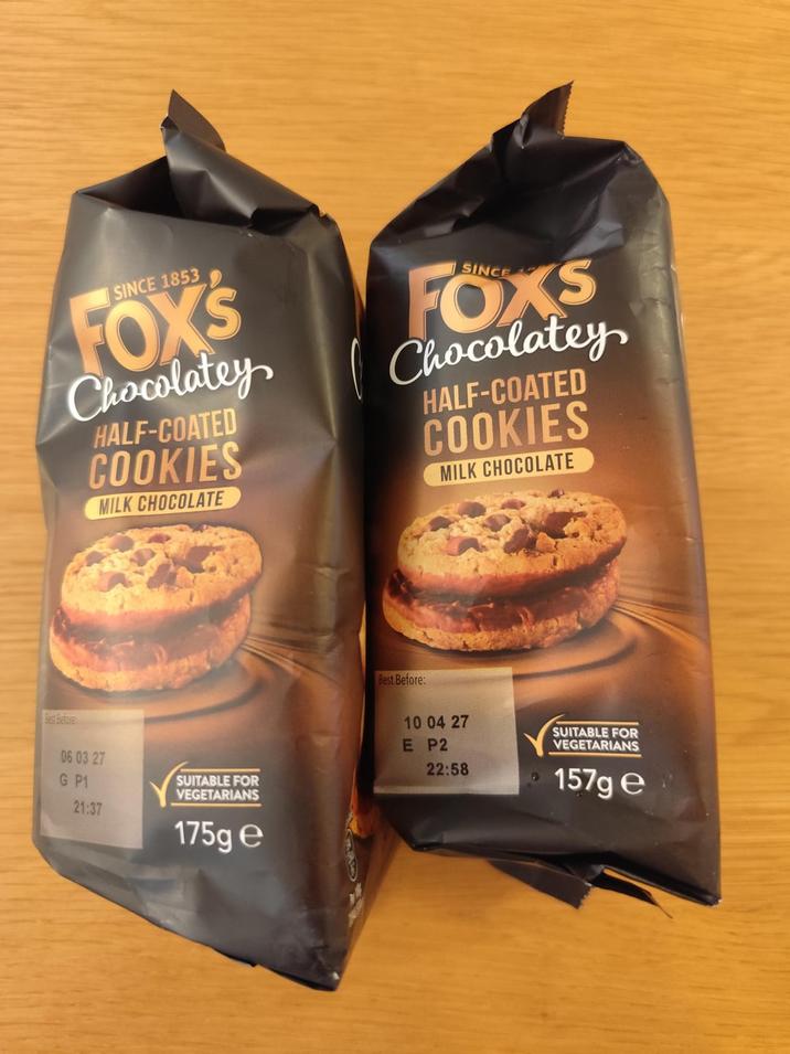 SINCE 1853 FOX'S Chocolatey HALF-COATED COOKIES MILK CHOCOLATE SINCE FOXS Chocolatey HALF-COATED COOKIES MILK CHOCOLATE Best Before 06 03 27 G P1 SUITABLE FOR VEGETARIANS 21:37 175g e Best Before: 10 04 27 E P2 22:58 SUITABLE FOR VEGETARIANS 157g e