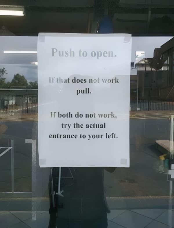 Push to open. If that does not work pull. If both do not work, try the actual entrance to your left.