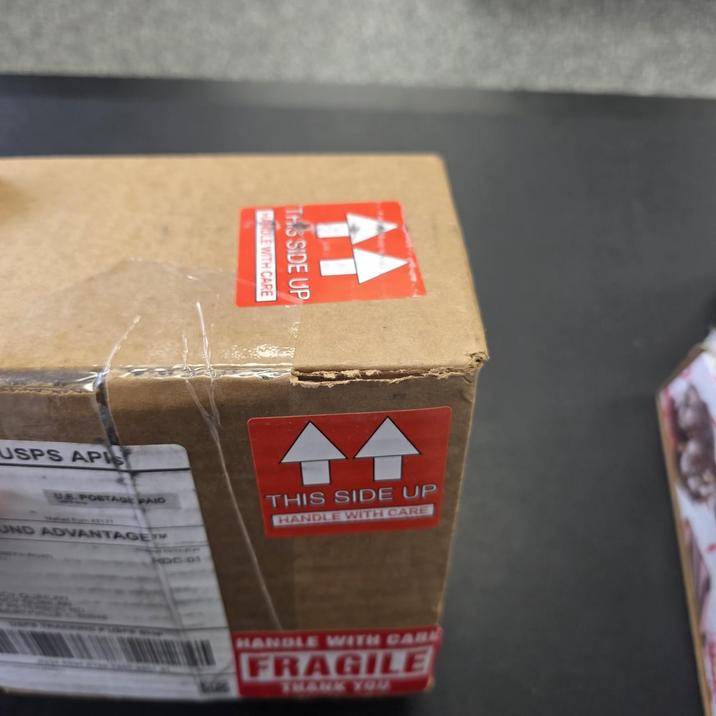 USPS APIS E POSTAGE PAID UND ADVANTAGE OLE WITH CARE THIS SIDE UP all 44 THIS SIDE UP HANDLE WITH CARE HANDLE WITH CARE FRAGILE THANK YOU