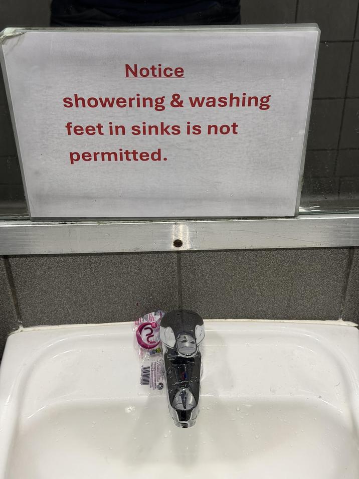 Notice showering & washing feet in sinks is not permitted.