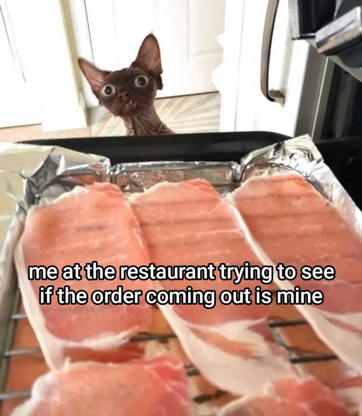 me at the restaurant trying to see if the order coming out is mine