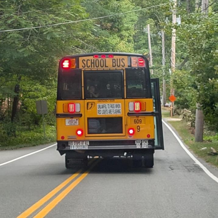 SCHOOL BUS 45934 DREAMENCY DOOR UNLAWFUL TO PASS WHEN RED LIGHTS ARE FLASHING 609 9 BUS STOPS AT ALL RR GROSSINGS KEEP BACK