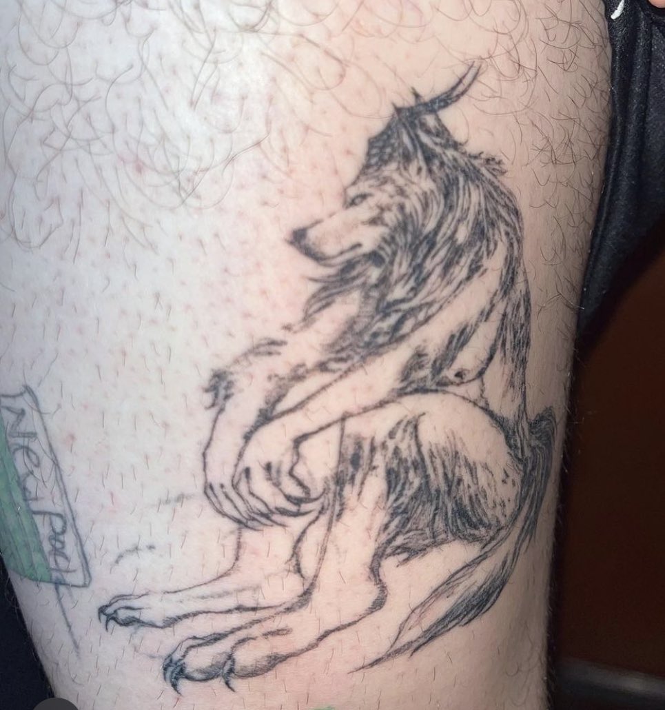 sitting howling wolf tattoos