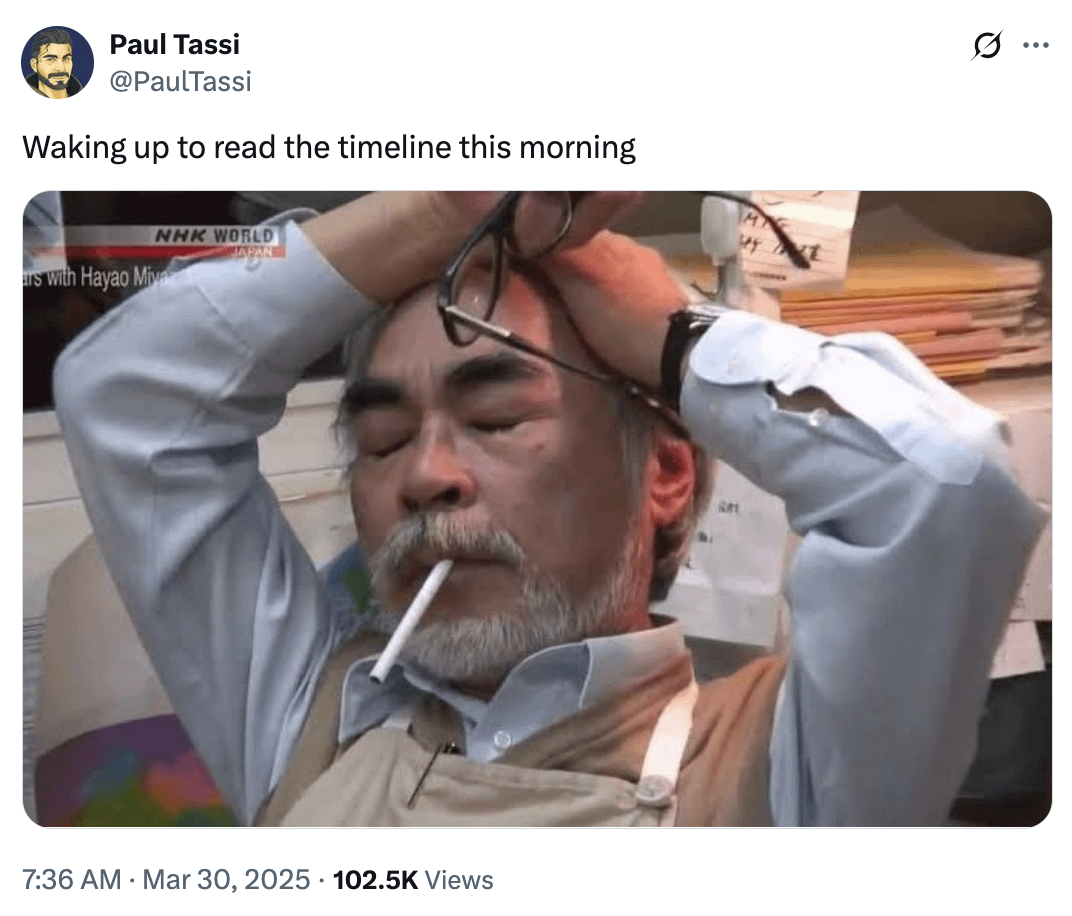 A meme featuring Studio Ghibli co-founder and animator Hayao Miyazaki. The image shows him looking stressed with a c-------- in his mouth and his eyes closed. This tweet by @PaulTassi reads, "Waking up to read the timeline this morning."