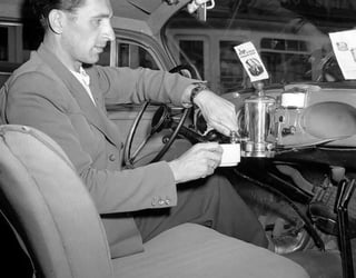 A dashboard coffee maker on the 1959 Volkswagen Beetle