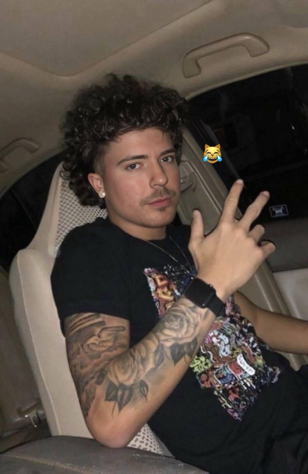 A photo of MrLean, aka Hood "MrBeast":https://knowyourmeme.com/memes/people/mrbeast, in a car from the "AI Art":https://knowyourmeme.com/memes/cultures/ai-art and "photoshop":https://knowyourmeme.com/memes/sites/photoshop edit trend in May 2025.