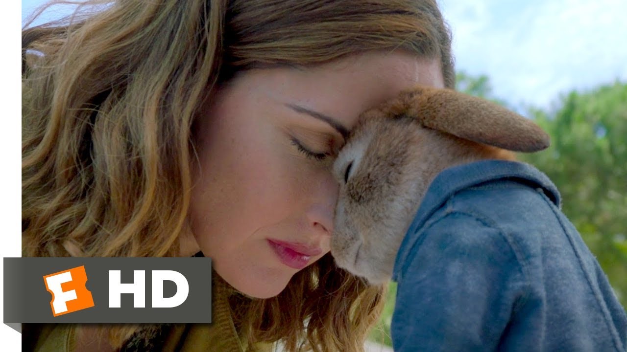 The Fandango "YouTube":https://knowyourmeme.com/memes/sites/YouTube thumbnail of Peter Rabbit touching his head to Rose Byrne's head in a scene from the 2018 film _Peter Rabbit_.