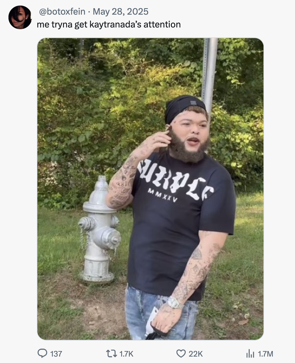 X user @botoxfein tweeted a still from Druski's "White Face" video, writing, "me tryna get kaytranada’s attention," and gathering over 22,000 likes in a day. The tweet presupposes that Kaytranada is only into light-skinned people.