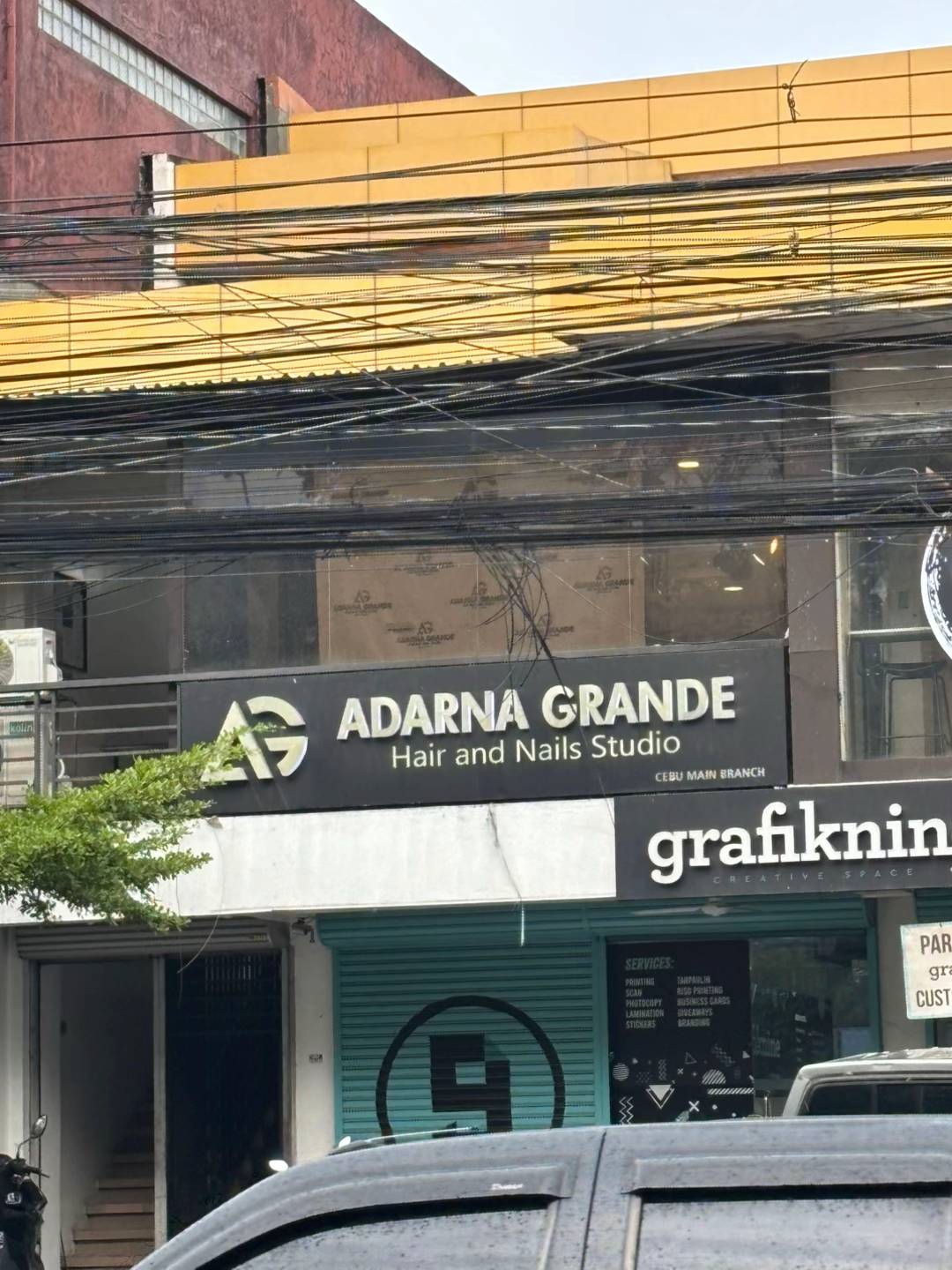 A photo of a business called "Adarna Grande," which resembles the name of the American popstar "Ariana Grande":https://knowyourmeme.com/memes/people/ariana-grande. The post was a part of a mid-2025 "TikTok":https://knowyourmeme.com/memes/sites/tiktok trend.
