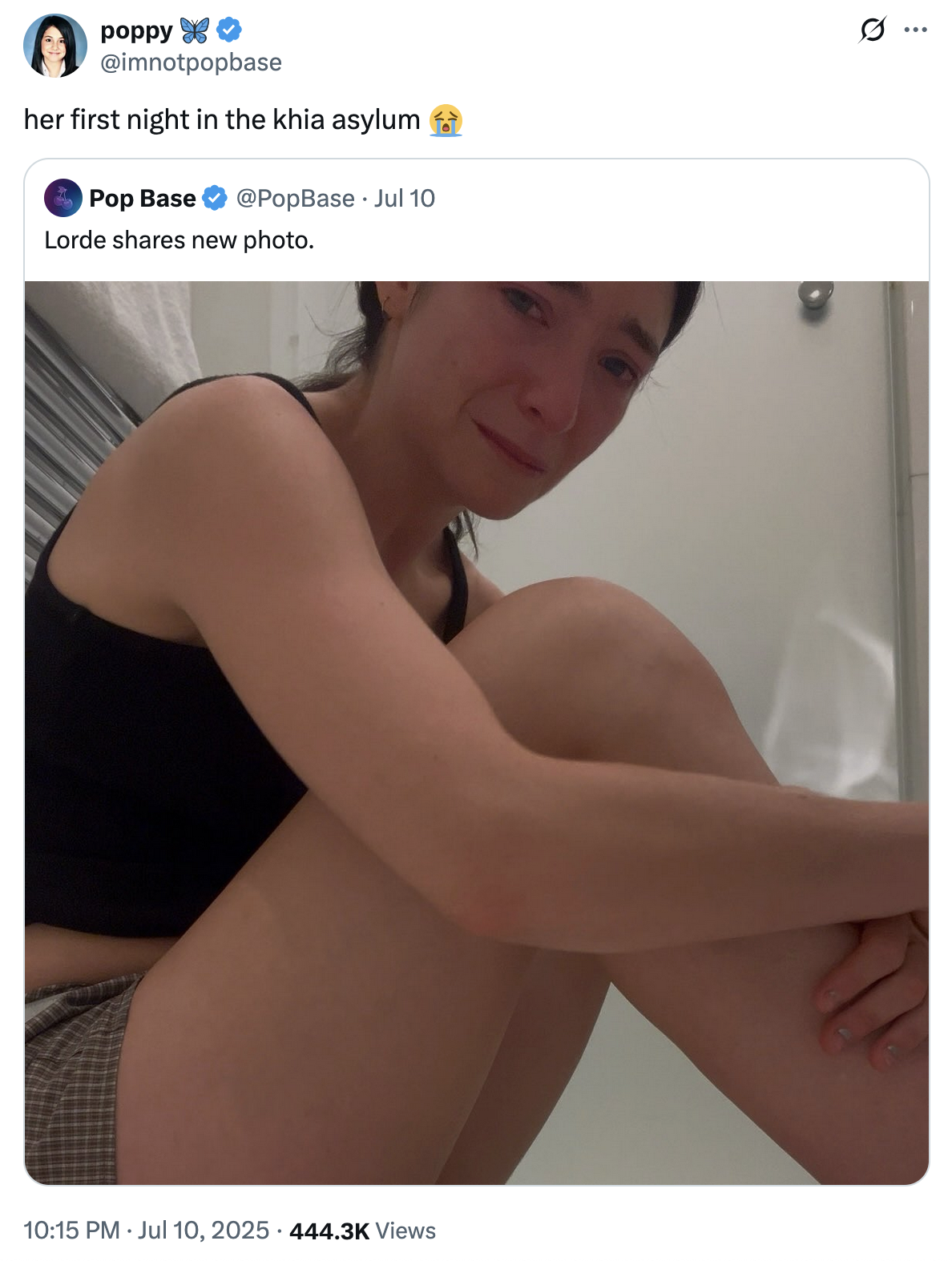 X user @imnotpopbase quoted a PopBase post showing Lorde looking into the camera while hugging her knees and crying, writing, "her first night in the khia asylum 😭" and gathering over 9,000 likes in five days.