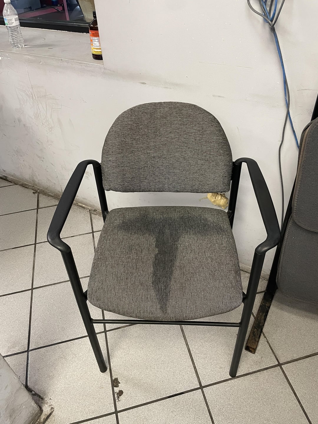 The chair in the mechanic's waiting room