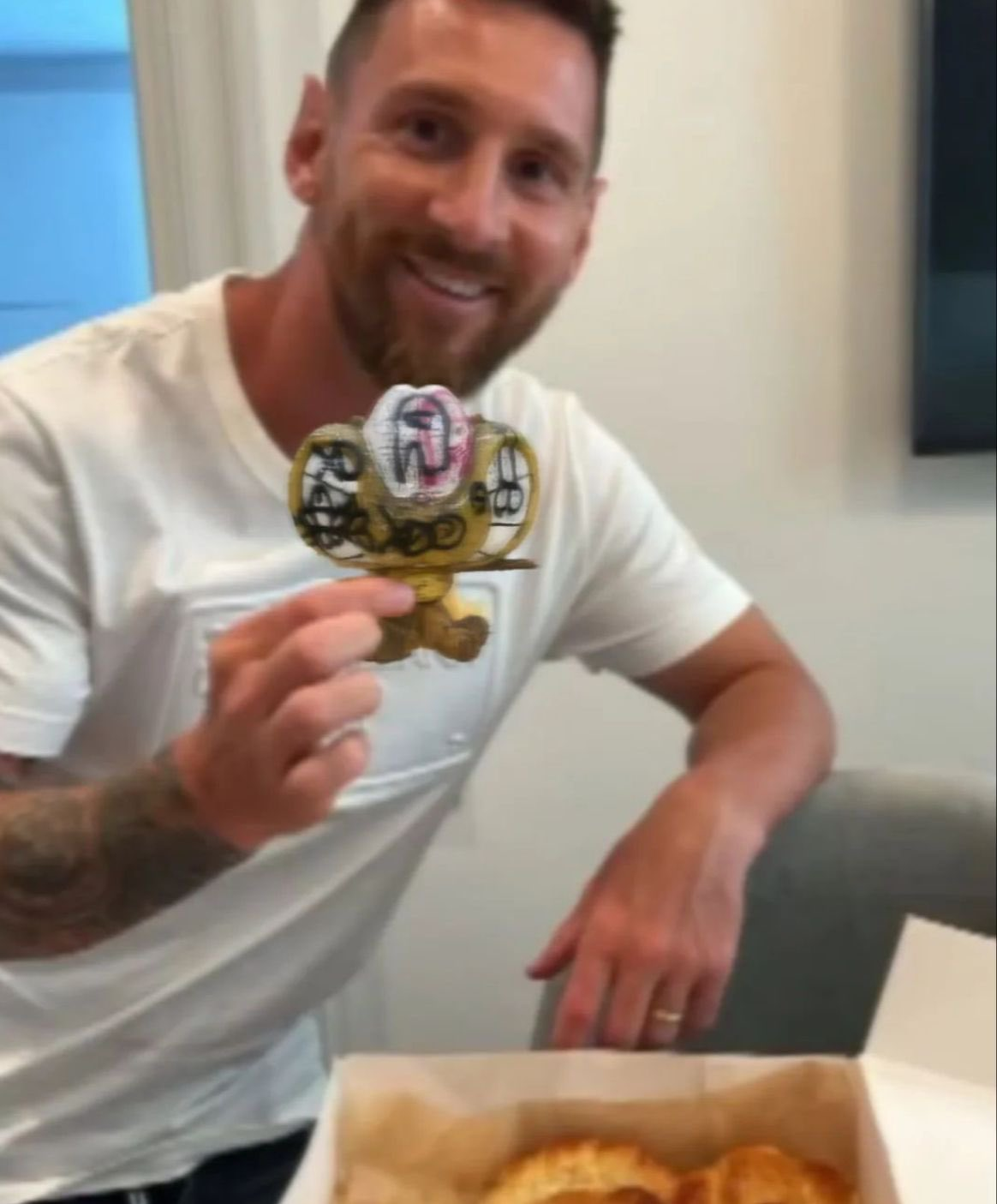Messi with a Gaturro figure