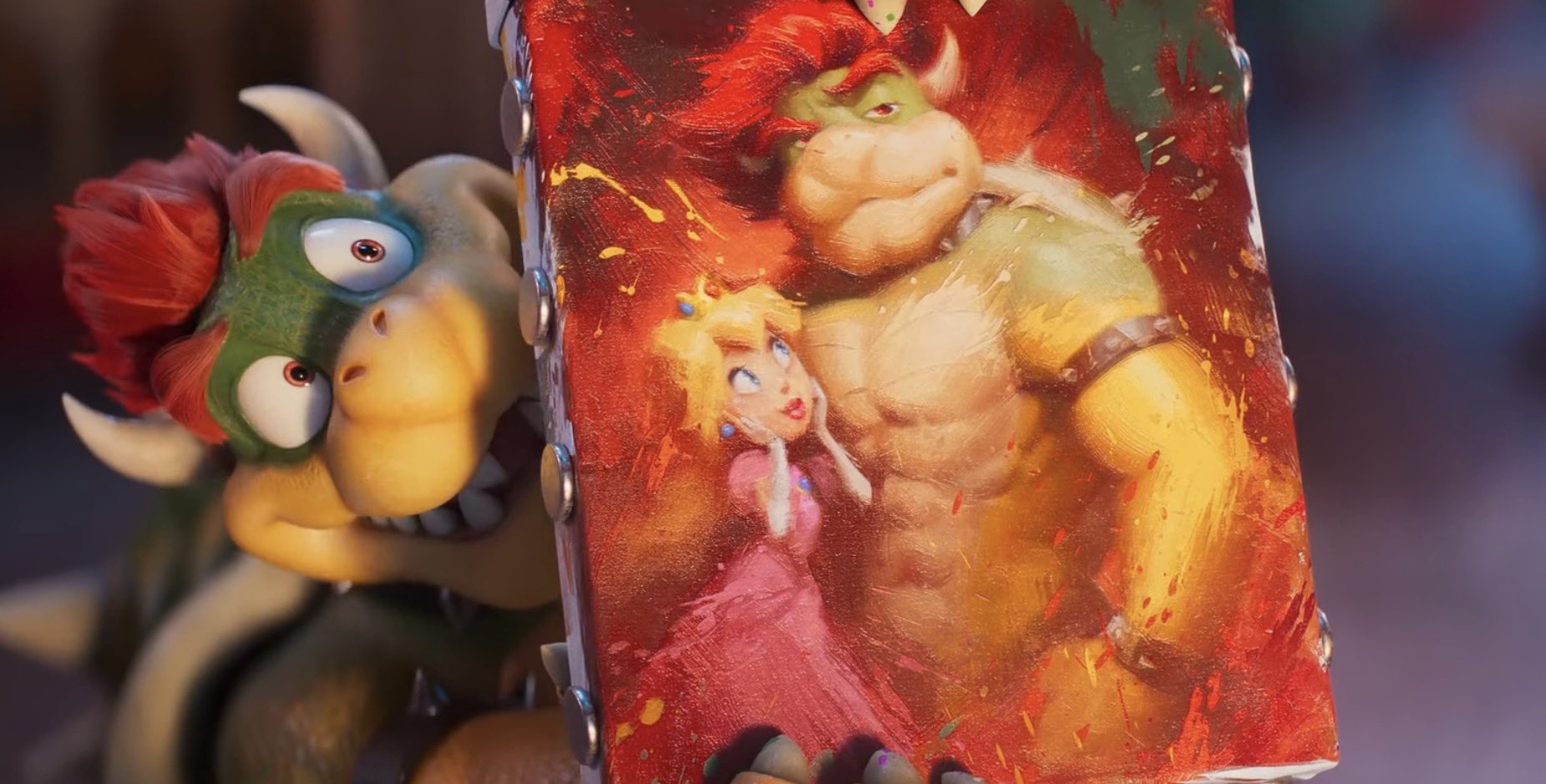 A screengrab from "The Super Mario Galaxy Movie" trailer of Bowser showing a painting to Mario and Luigi. The painting shows Bowser with abs next to Peach.