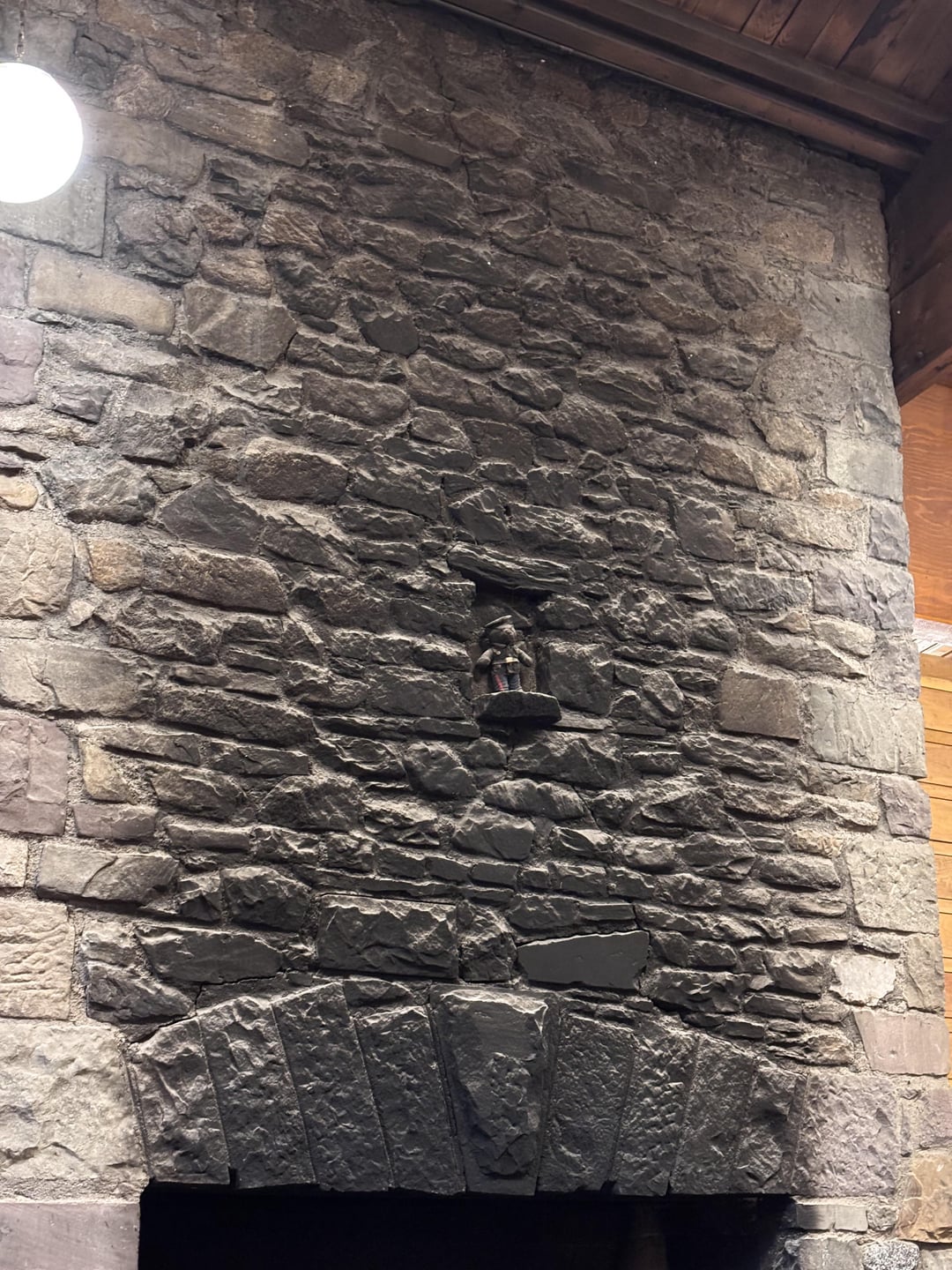 A bear covered in years of soot