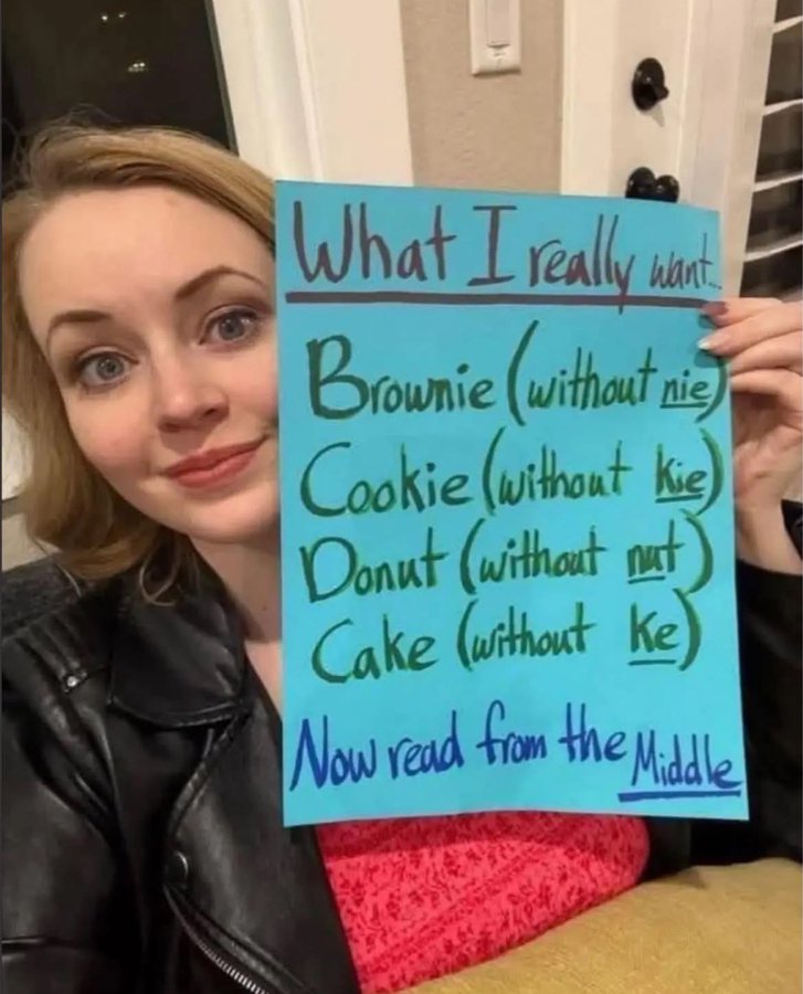 A meme of a woman holding up a sign. The sign has some engagement bait written on it.