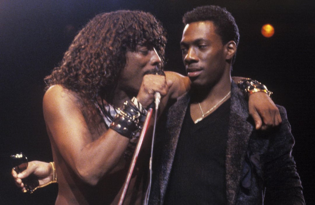 Rick James and Eddie Murphy performing on stage during the mid 1980s