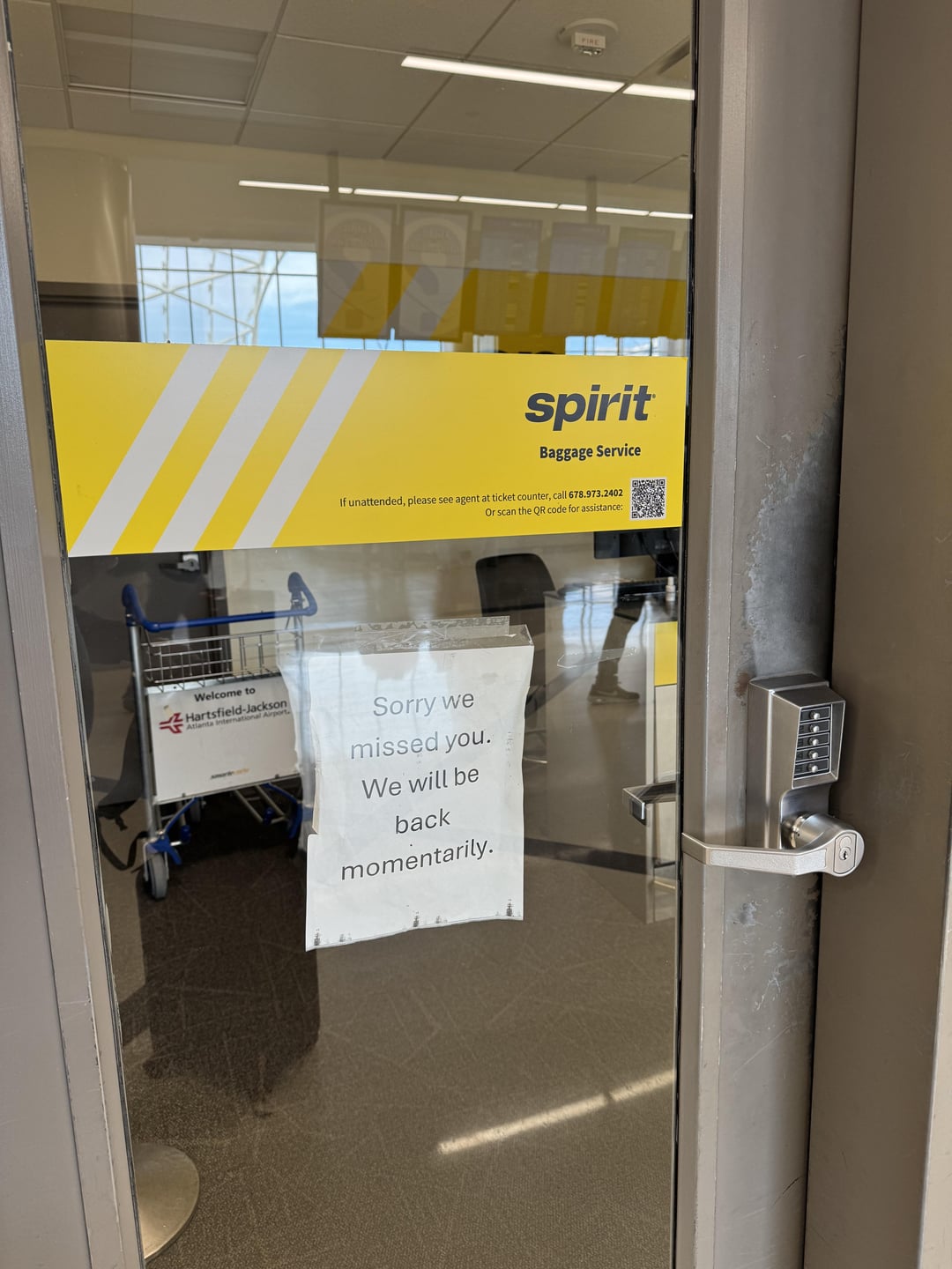 Welcome to Hartsfield-Jackson Atlanta International A FIRE spirit Baggage Service If unattended, please see agent at ticket counter, call 678.973.2402 Or scan the QR code for assistance: Sorry we missed you. We will be back momentarily.