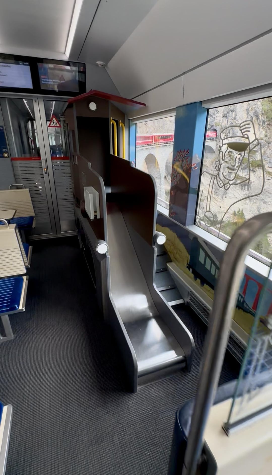 This Swiss train has a slide for children